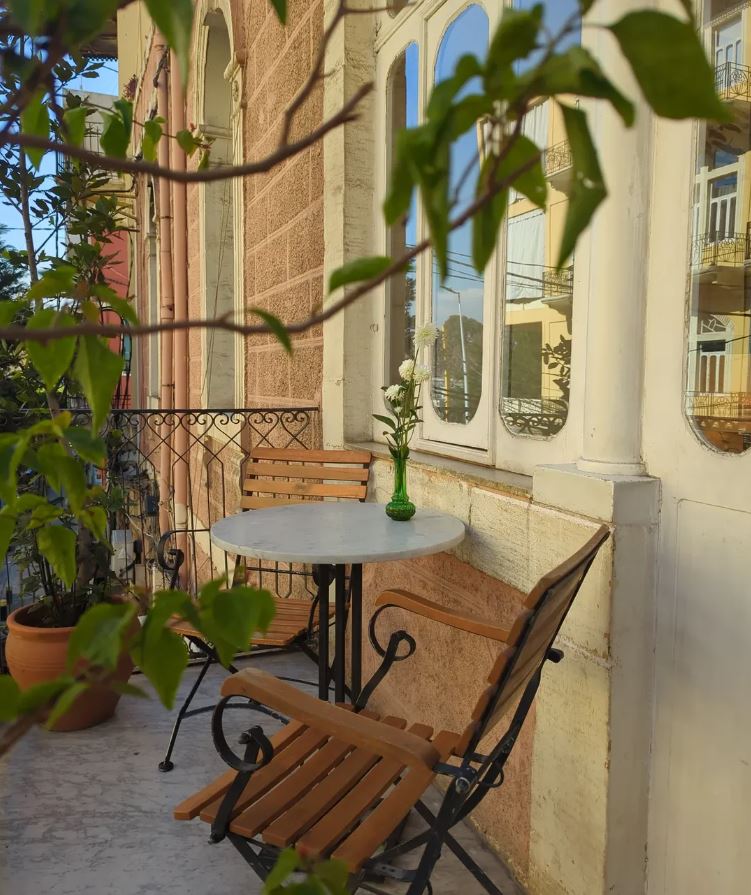 Garden courtyard seating at BEYt, old house windows behind